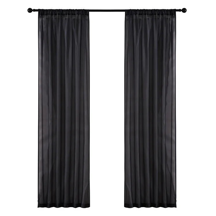 Modern simple pure black cotton linen polyester vertical window curtain hung, showing light transmission and textured craft detail.