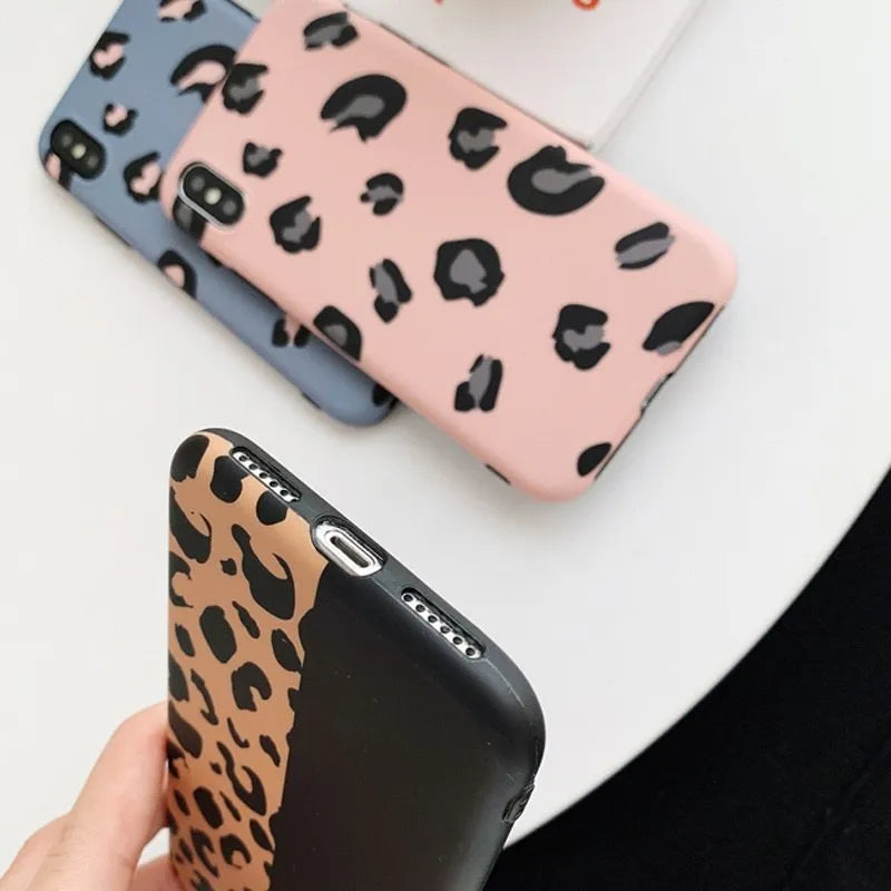 Leopard print pattern protective back cover case for iPhone, shown in black, blue, and pink colour options.