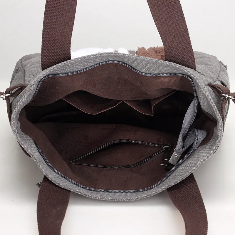 KVKY women canvas bag with plush cat applique in beige, showing shoulder strap and front pocket