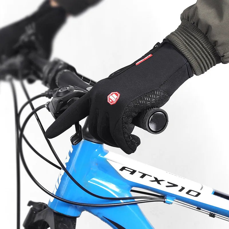 Pair of winter touch screen riding gloves in blue with polar fleece lining and antiskid grip for motorcycle use