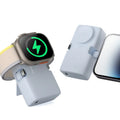 Small white plastic wireless power bank showing dimensions and Qi charging symbol.