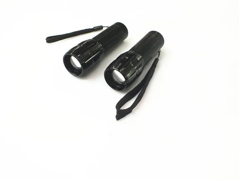 Black mini LED flashlight with telescopic head and tail push button switch, head diameter 3.1 cm