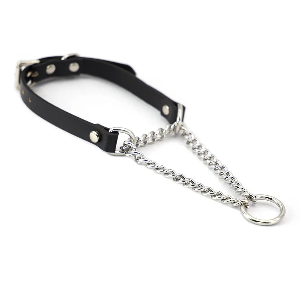 Black leather collar with chain detail and attached black leash on a dark background.