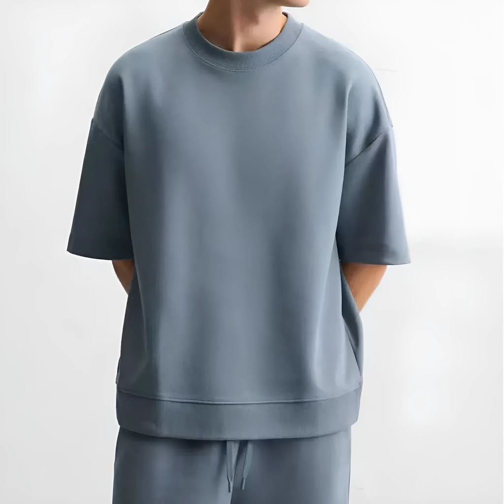Loose double-sided cloth texture short sleeve top and matching shorts set in blue on a model.
