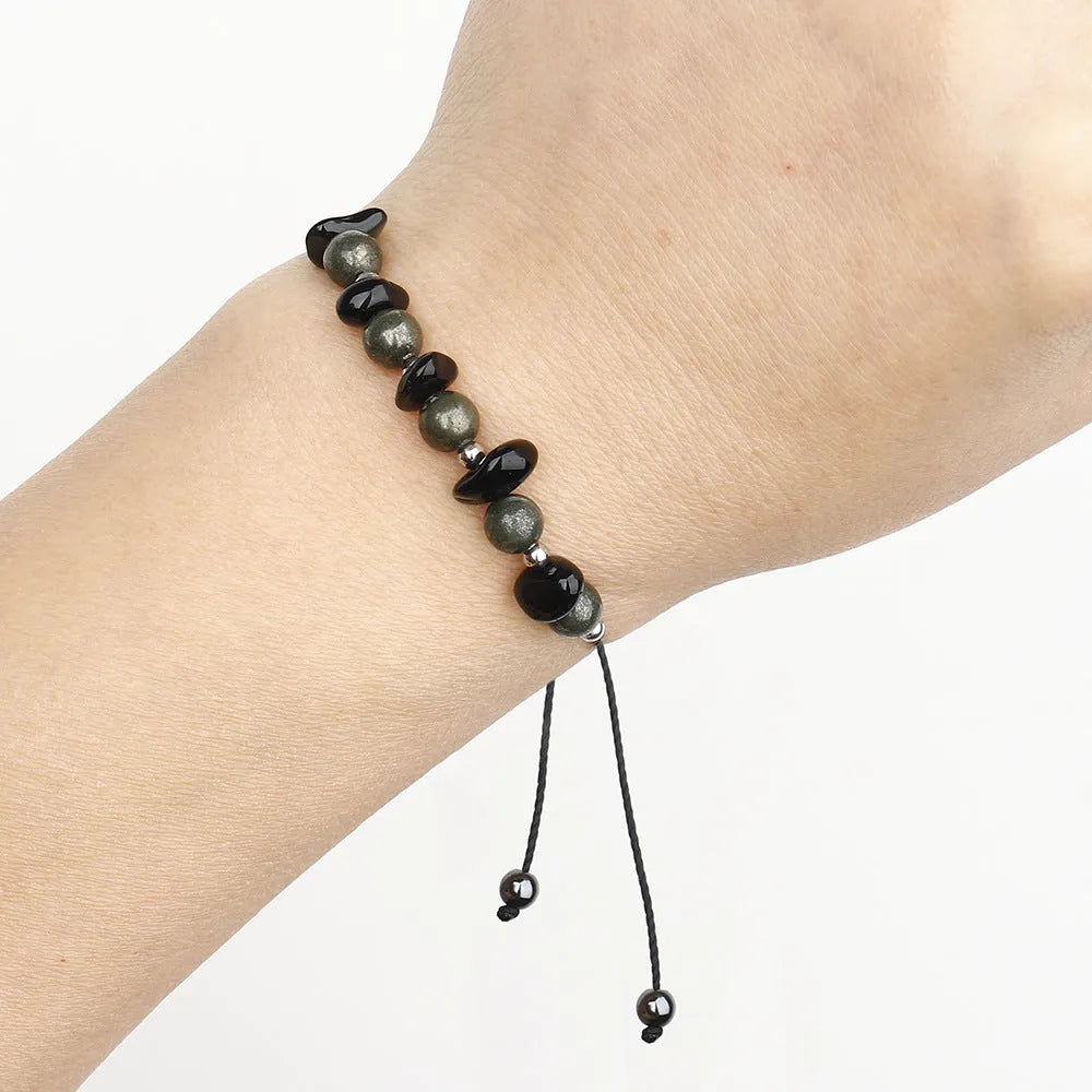 Black garnet geometric stone bracelet with moon charm on wrist