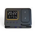 Black 5-in-1 wireless charging station displaying time and temperature, charging a phone and a smartwatch.