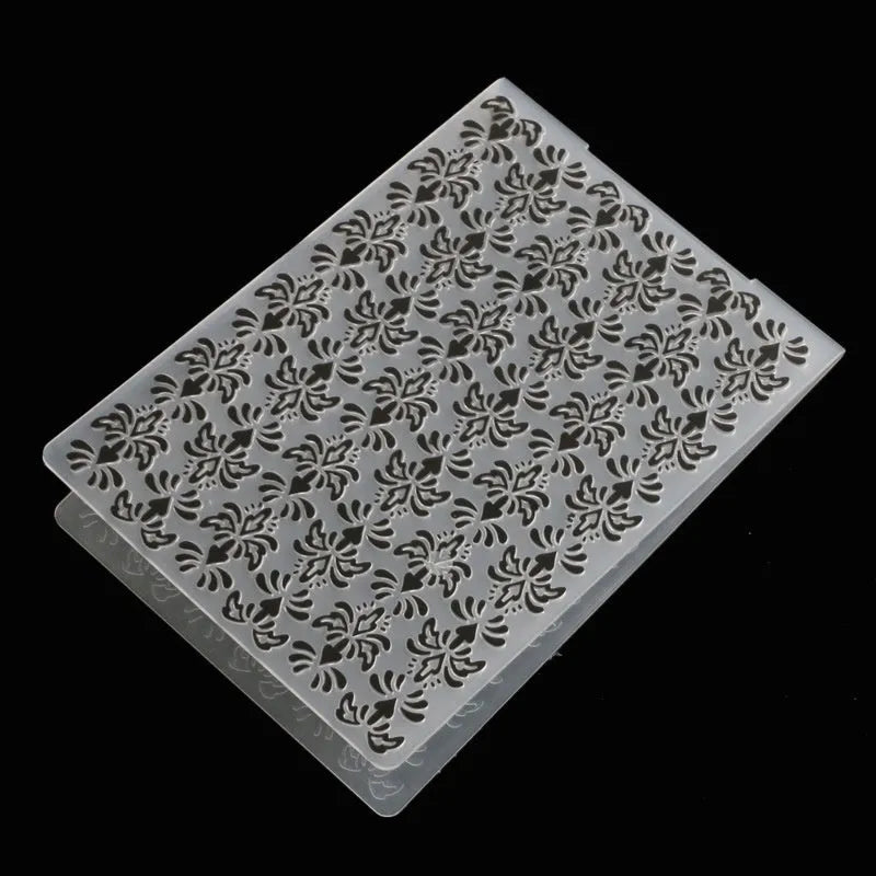 Plastic cake decorating mould showing windmill and flower shapes, folding size 14.5 by 10.5 cm.