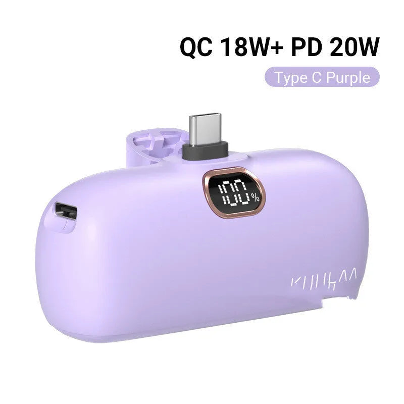 Compact cylindrical alloy power bank with built-in charging cable and LCD digital display.