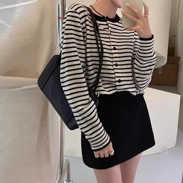 Dark grey and white striped slim fit cardigan coat for women with long sleeves.