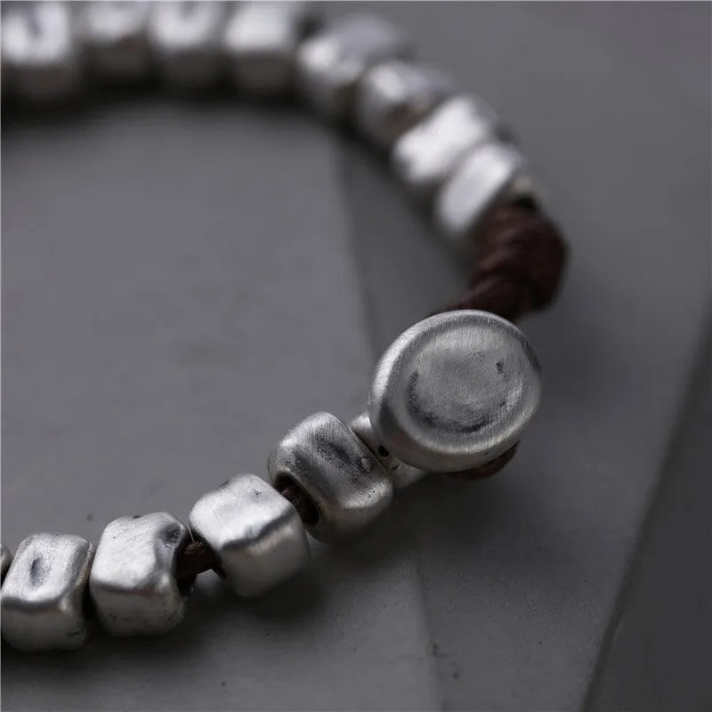 Handmade silver bracelet with irregular square design and wooden elements on 17cm elastic band