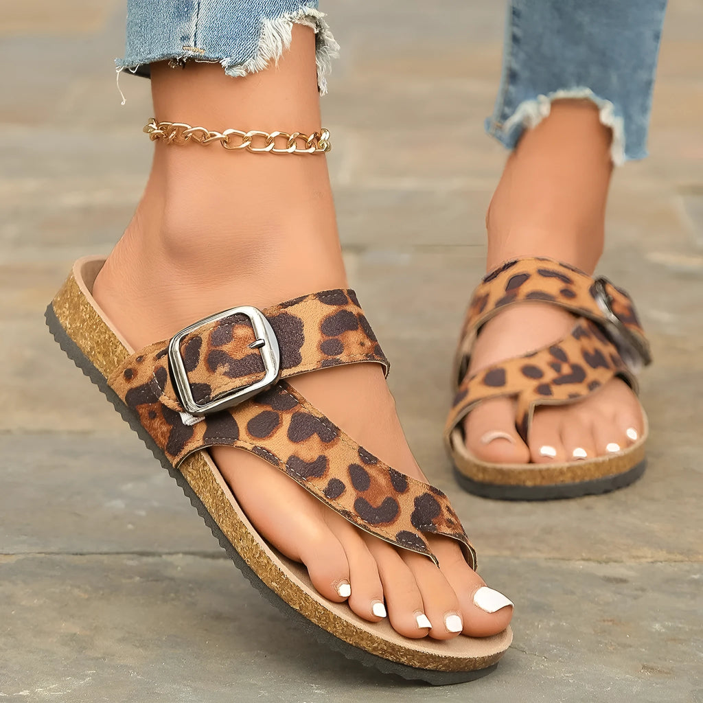 Leopard print Roman style slippers with covering toe and wooden sole.