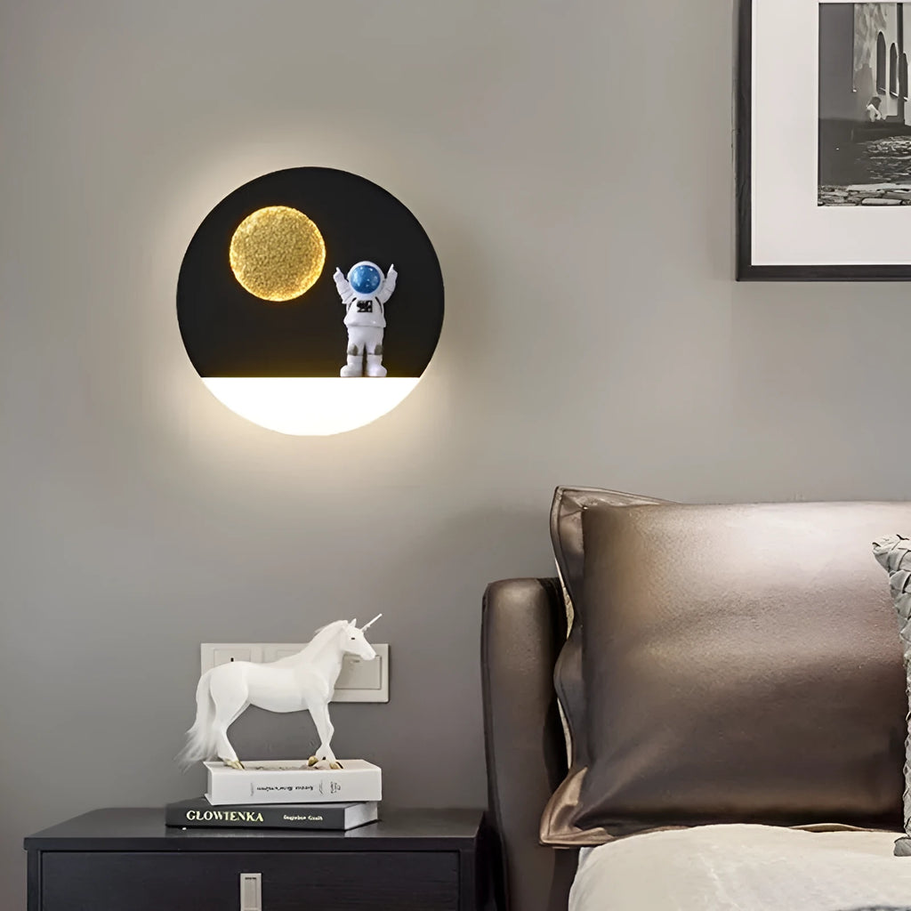 Astronaut-shaped wall lamp with shelf and LED lighting in black iron finish