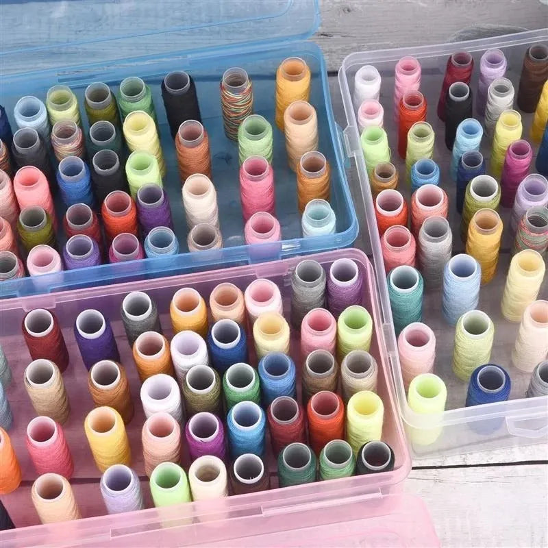 Plastic storage box with 42 compartments for organising embroidery threads and sewing kit accessories.