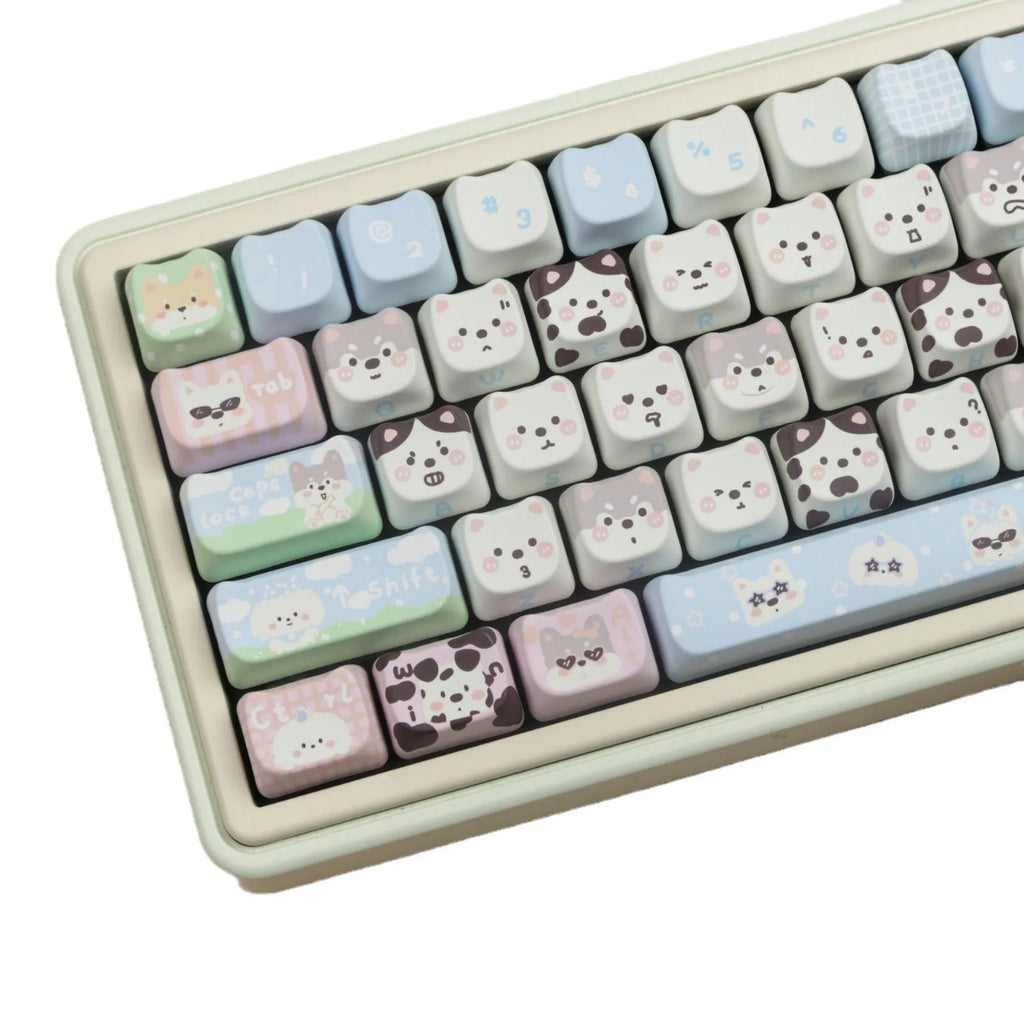 Colourful PBT key cap set for mechanical keyboards with printed cat and puppy designs.