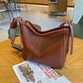 Genuine leather women's messenger bag with multiple internal compartments in black, sugar brown, golden brown, or dark green.