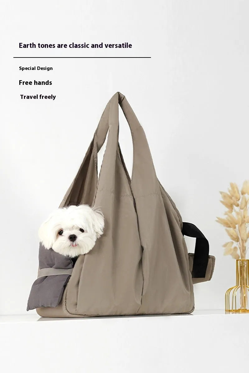 Apricot-colour cloth pet carrier handbag with mesh panels and a shoulder strap.