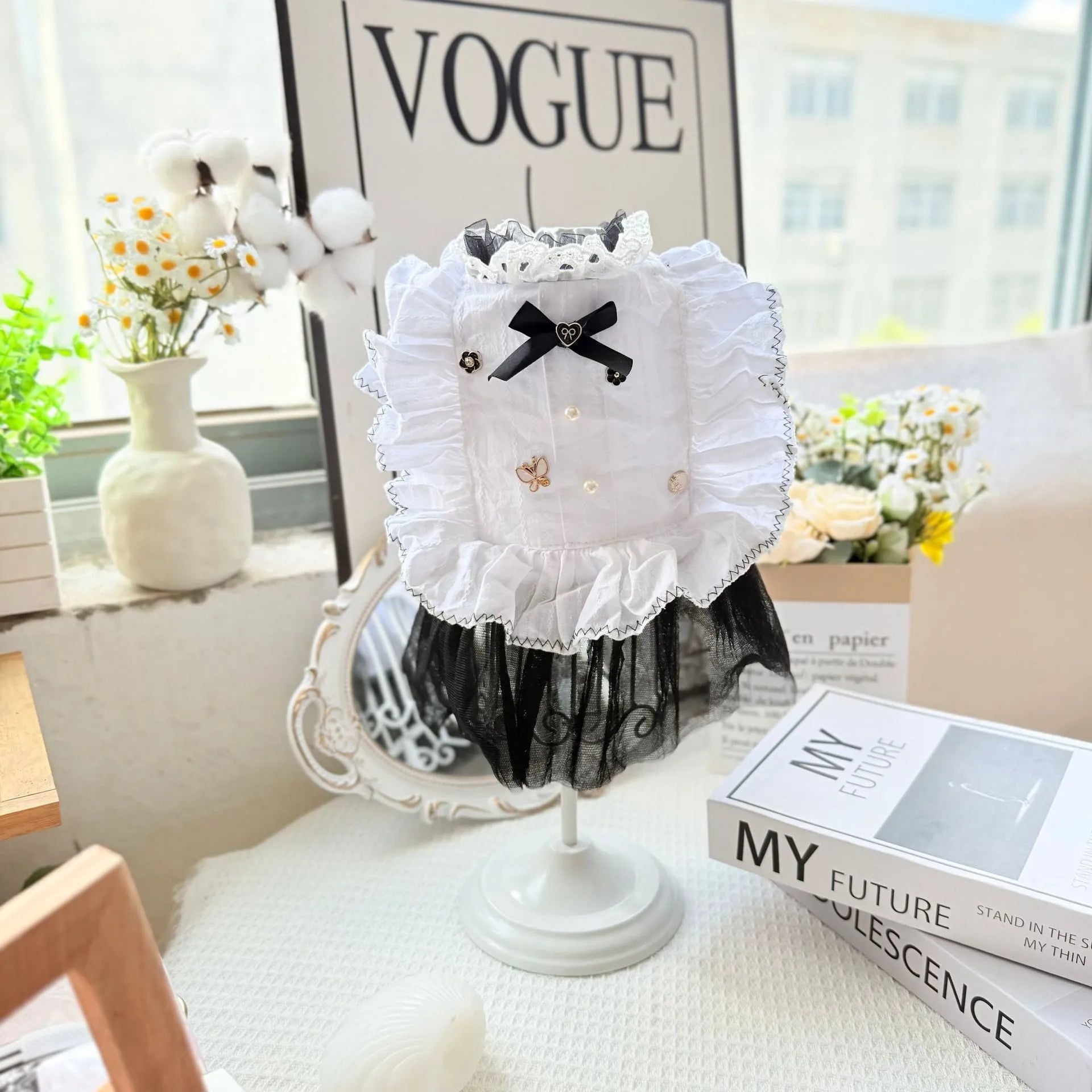 White yarn-trimmed polyester gauze skirt for a small dog on a mannequin, showing princess style.
