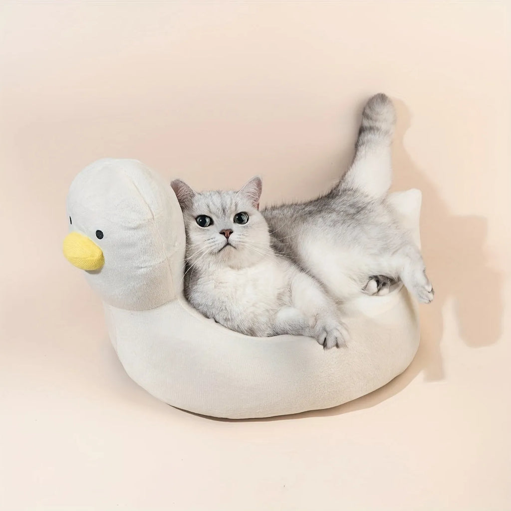 Blue duck-shaped fluffy pet bed for a small dog, showing raised rim and soft material.