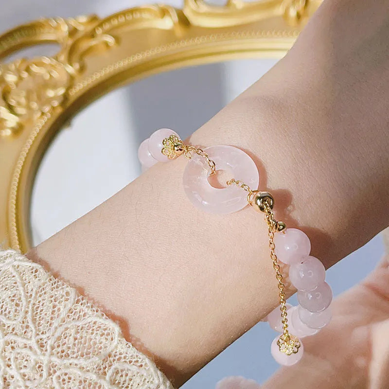 Pink crystal peace buckle bracelet on adjustable silver-plated chain for women