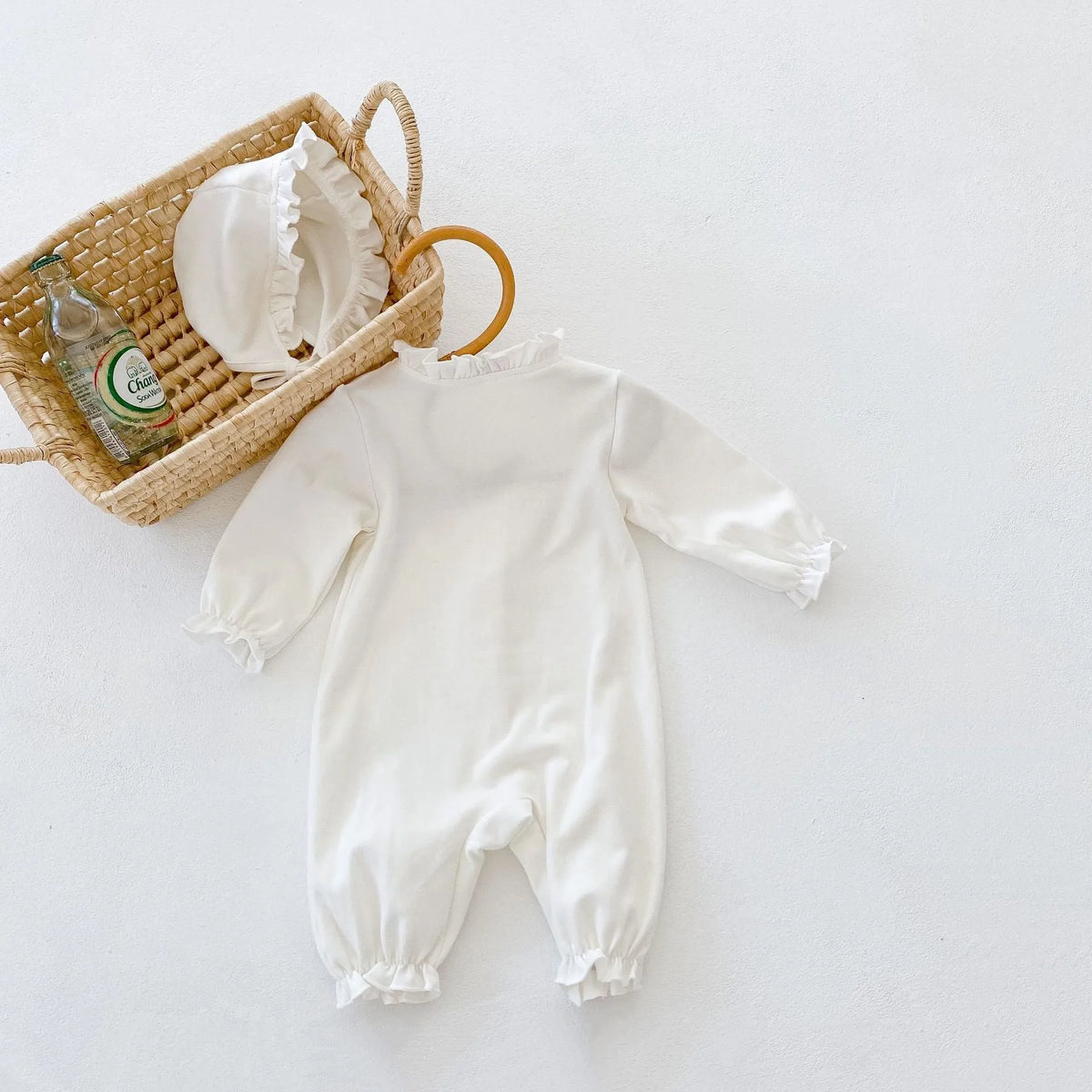 Beige knitted cotton hooded jumpsuit with wooden ear collar and lace, long sleeve, for baby and toddler autumn wear.