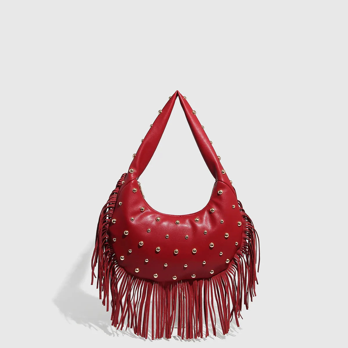 Retro tassel shoulder handbag in black colour showing decorative detail and shoulder strap