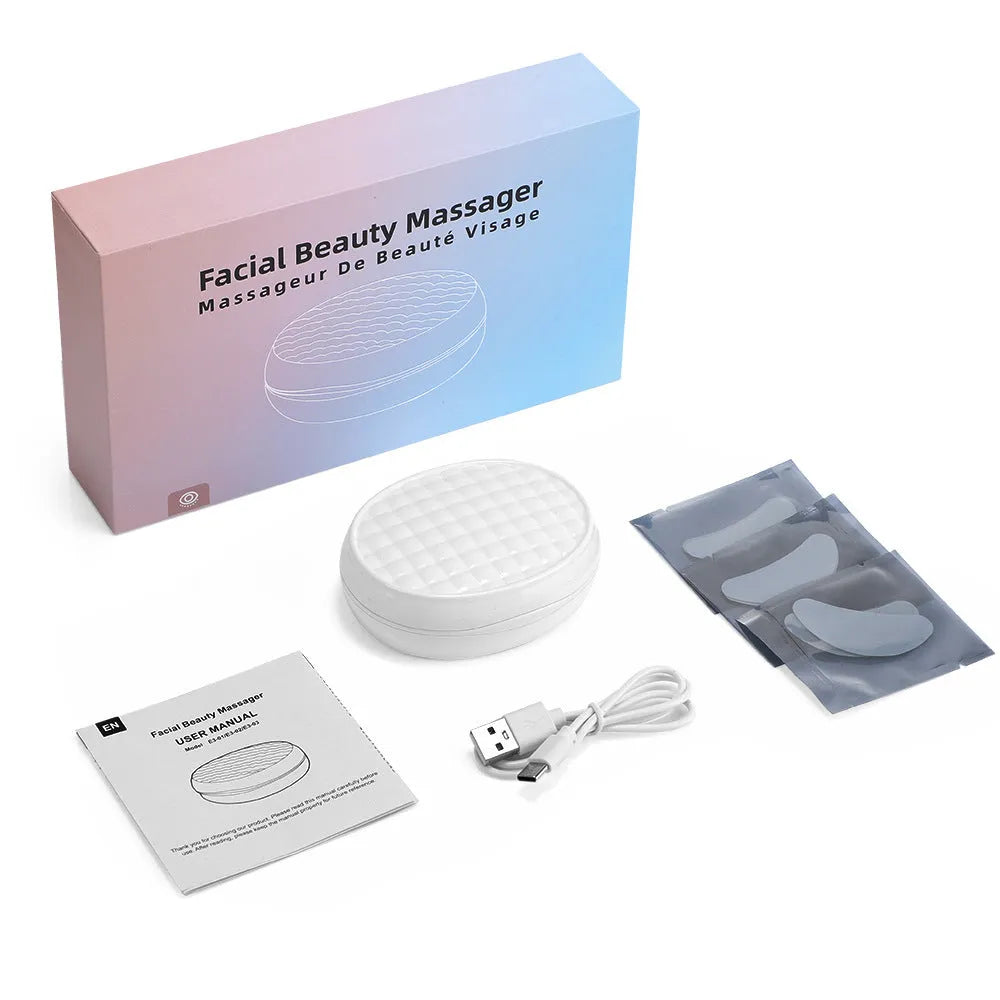 White wireless red light EMS handheld facial and eye massager on a clean background.