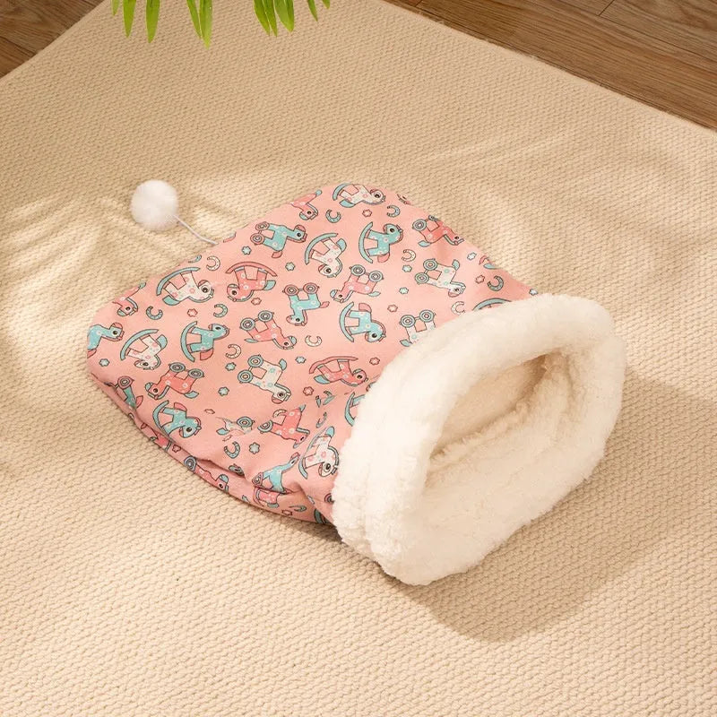 Flannel-lined cat sleeping bag bed measuring 50 by 40 cm in blue rabbit design.