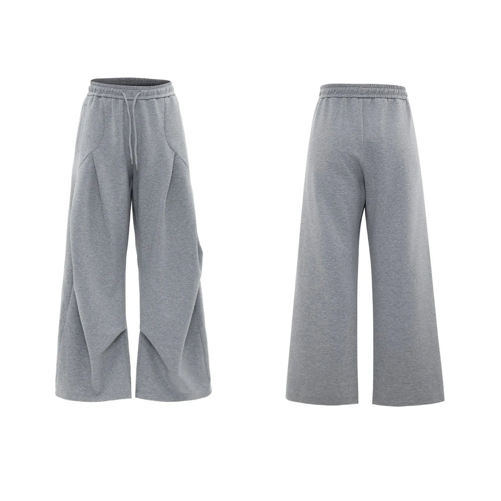 Men's dark grey cotton sports suit with padded shoulder shirt and shorts featuring metal embellishments.