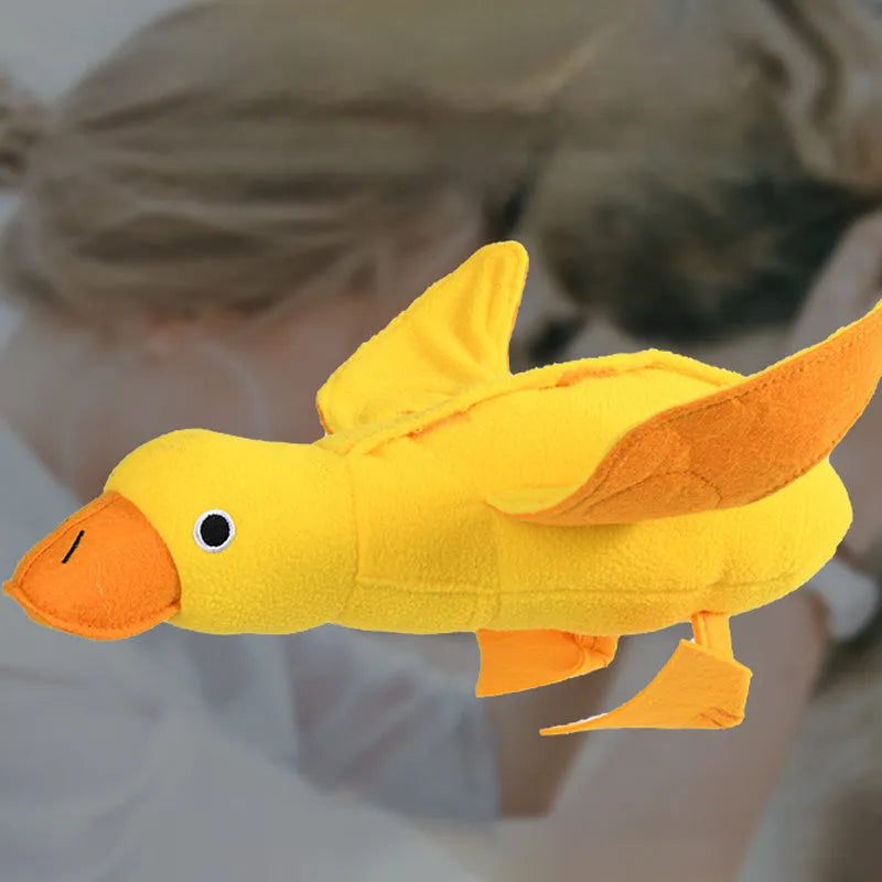 Yellow duck plush dog toy with squeaker and treat dispensing features