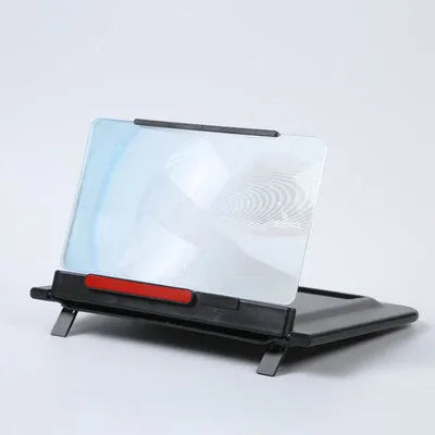 Black 12-inch pull-out screen amplifier showing horizontal and vertical phone bracket positions with Fresnel lens