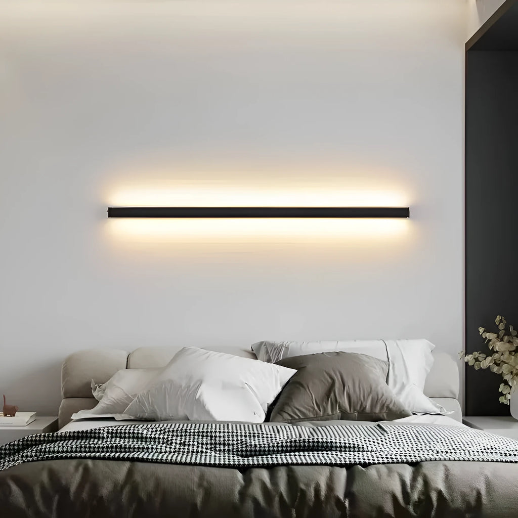 80cm long black aluminium LED wall lamp with touch control for three light colours on a plain wall.
