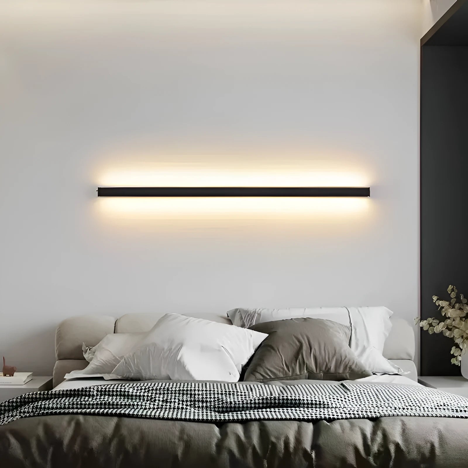 80cm long black aluminium LED wall lamp with touch control for three light colours on a plain wall.