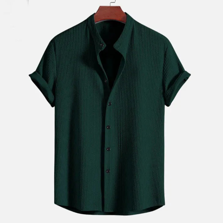 Mans loose-fitting short sleeve casual shirt in solid colour on hanger.