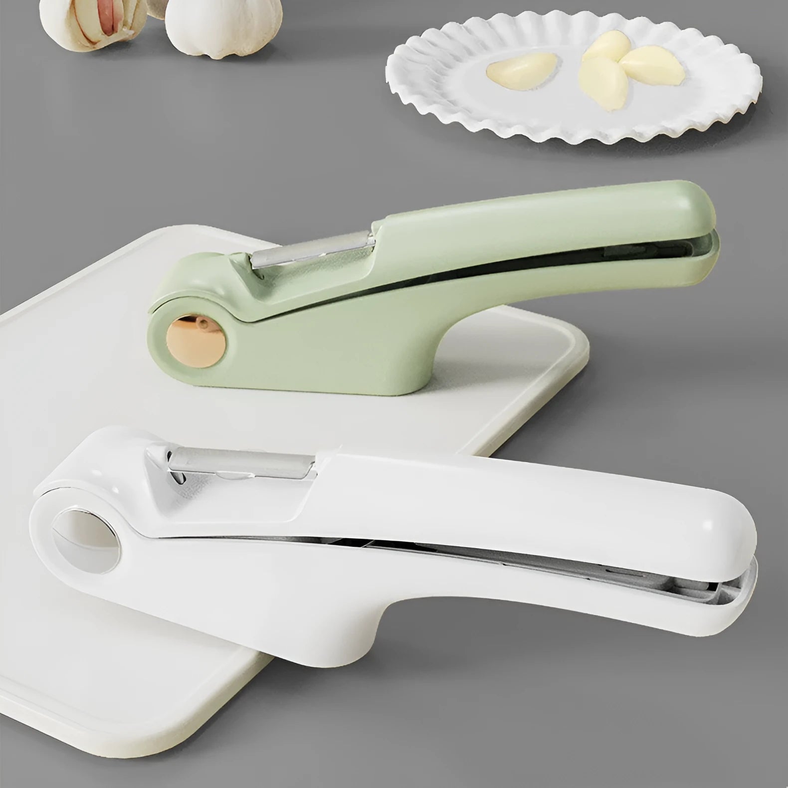Manual garlic press with stainless steel component and coloured ABS handle measuring 22cm