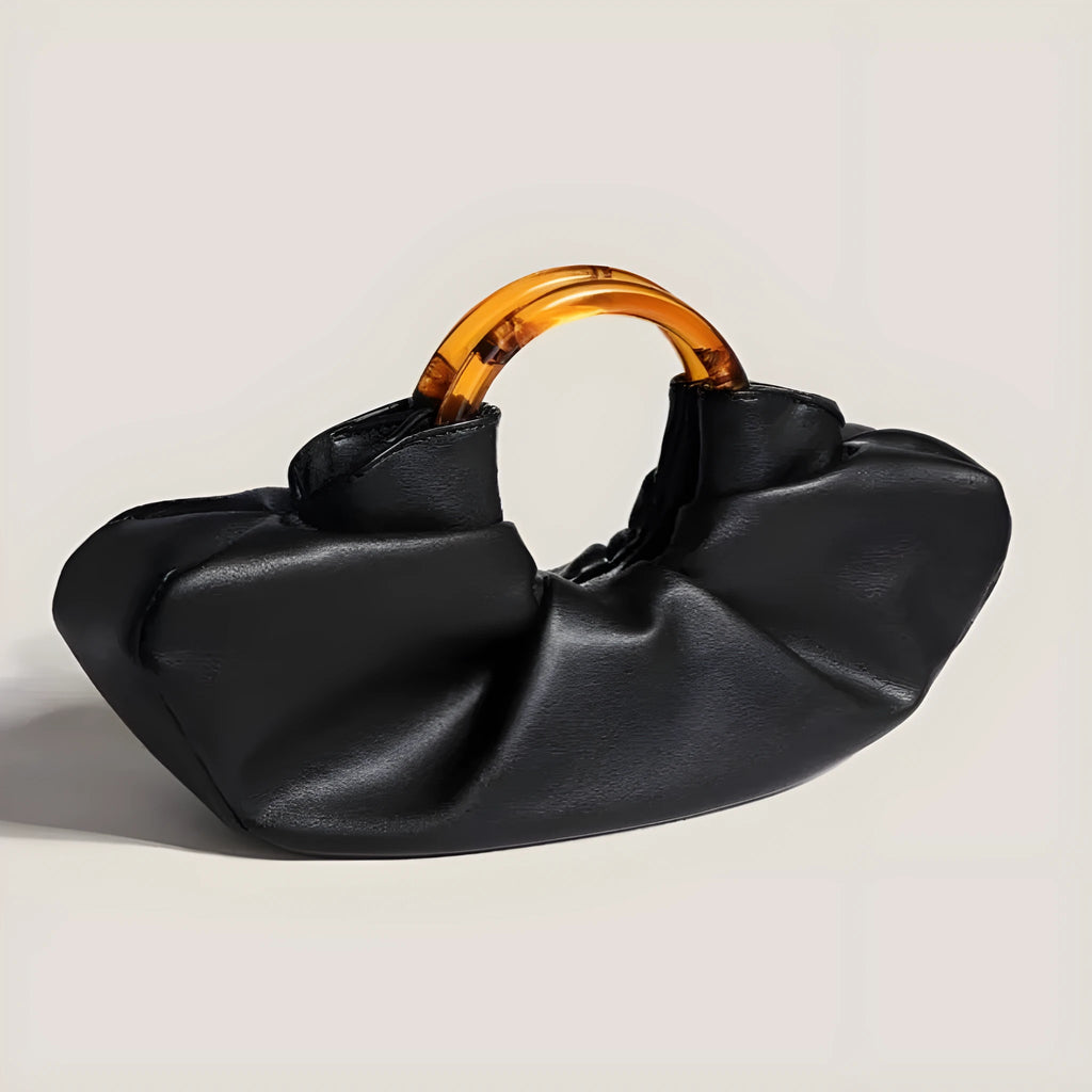 Niche Horn Bag acrylic ring handbag in black PU leather with fold design detail