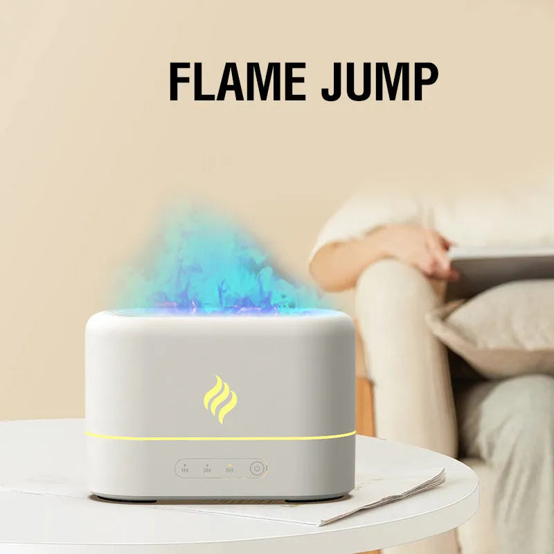 Black and white seven-colour flame effect USB aromatherapy humidifier on a surface, showing mist output.