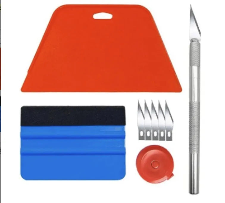 Plastic car window film smoothing tool set with squeegee and scrapers on a white background.
