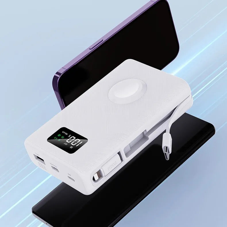 Black wireless power bank with charging bracket showing display screen and multiple USB ports