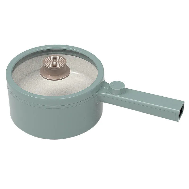 White and green multi-function electric cooking pot with temperature control dial and conversion plugs