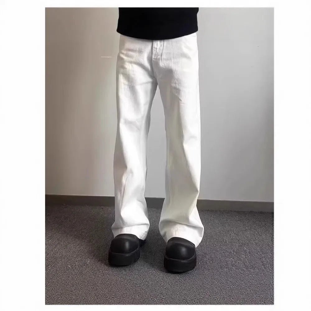 Men's white loose straight-leg wide-leg denim jeans on a mid-waist with a zipper fly.