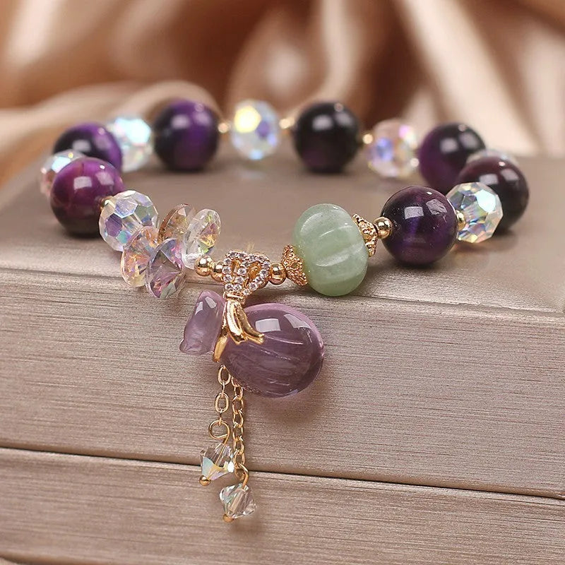 Women's purple tigereye crystal bracelet with money bag pendant and rhinestone decoration in forest style design