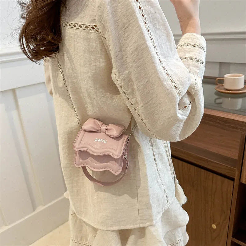 Mini PU crossbody handbag in multiple colours including black, pink, and silver