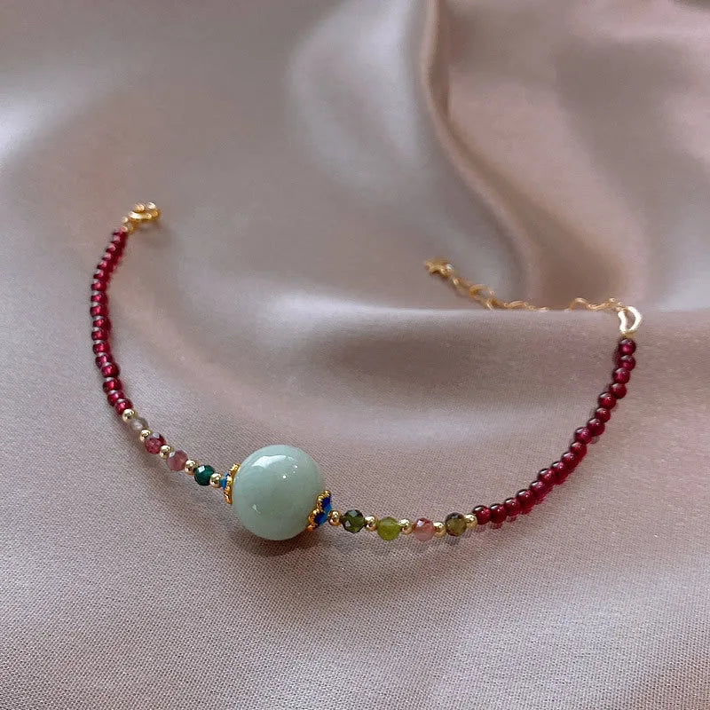 Simple aquamarine garnet bracelet with drop-shaped tourmaline stones and electroplated metal components