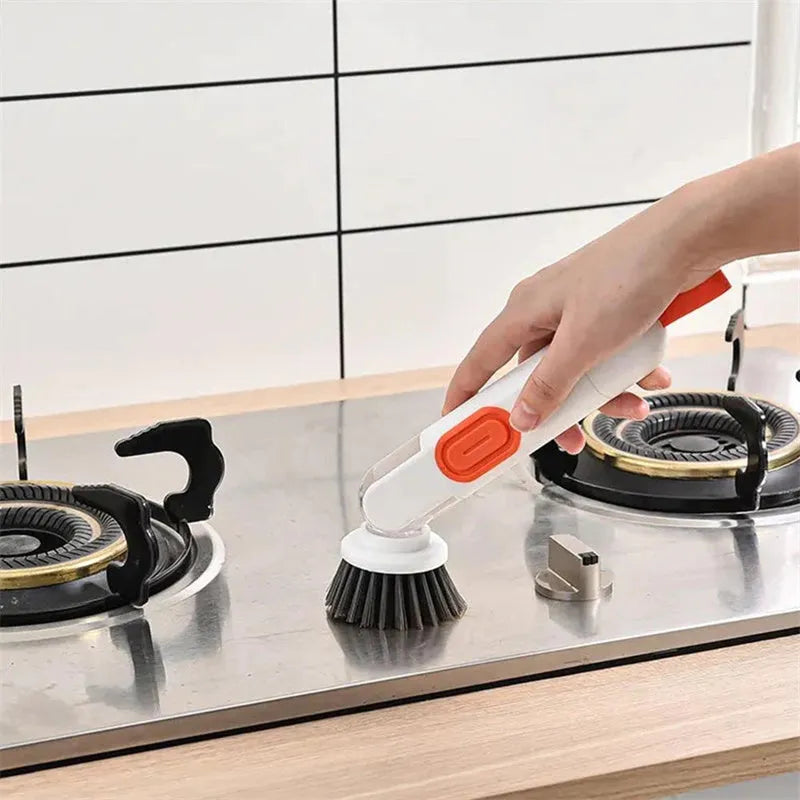 White and green liquid-filled cleaning brush with soap dispenser handle and two brush heads for kitchen cleaning