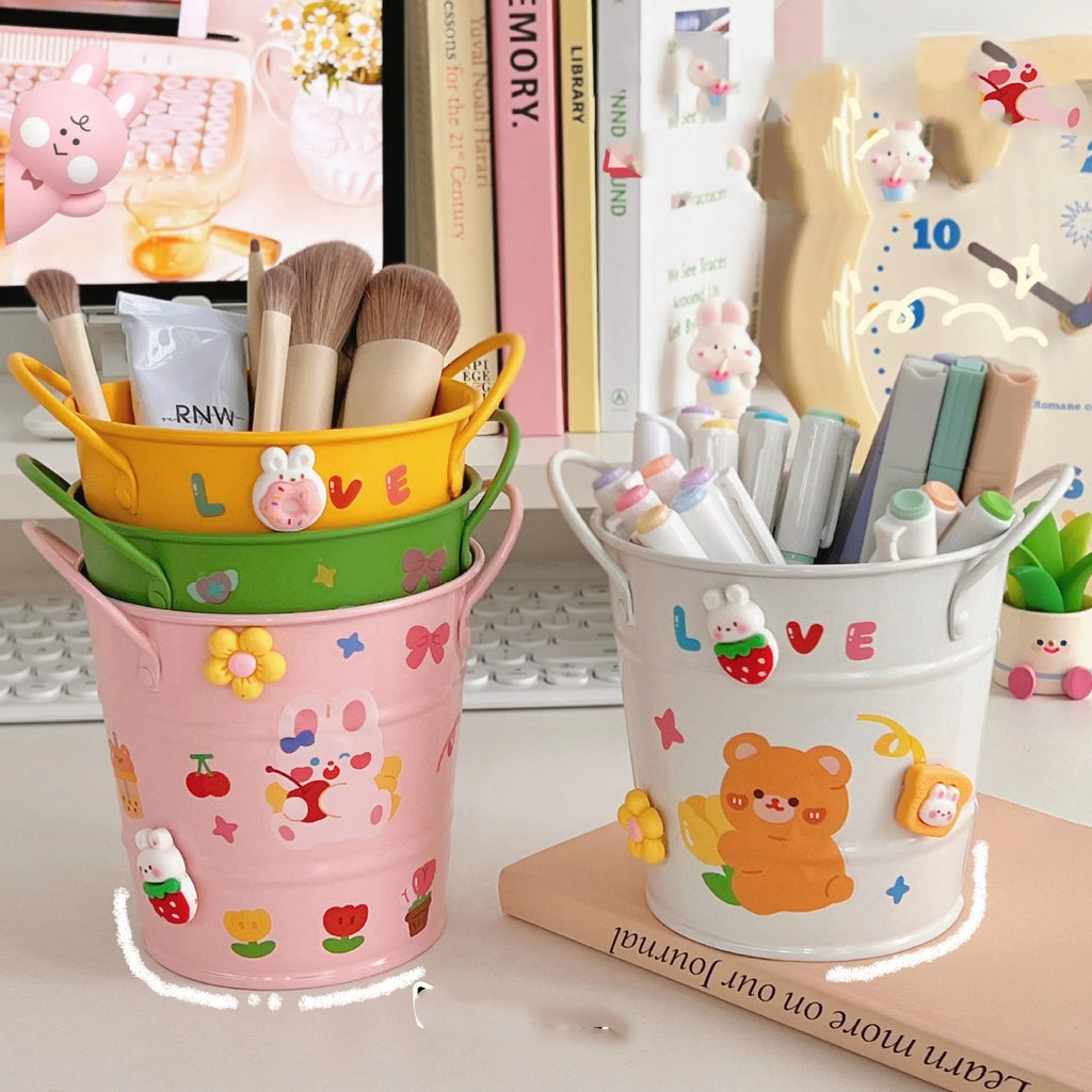Round metal desktop pen holder storage box in a choice of colours including pink, green, red, white, and yellow.