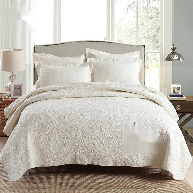 Double-sided pure cotton bed cover three-piece set in a light grey damascus pattern on a bed.
