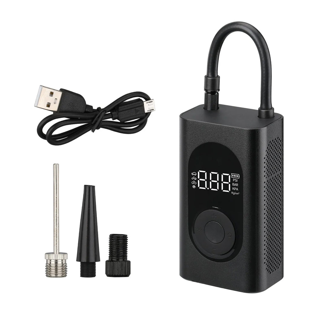 Black portable wireless tyre pump with digital display, LED flashlight, and USB cable on a grey background.
