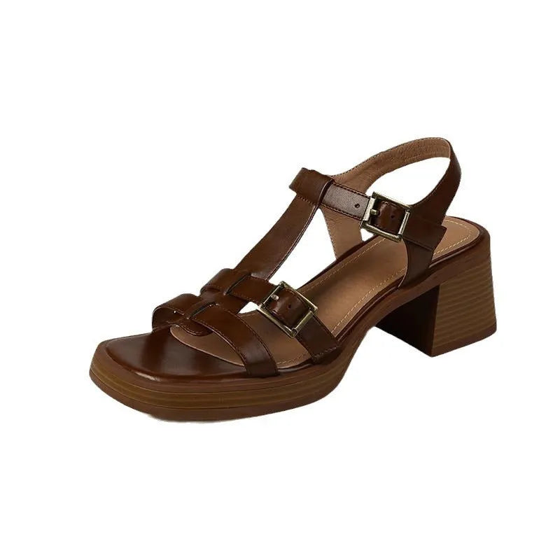 Black women's retro sandals with a T-buckle strap, chunky platform heel, and open square toe