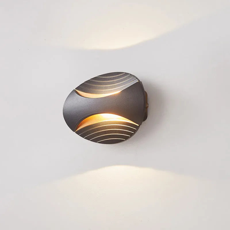 Modern aluminium wall lamp in metallic finish with wall-mounted design for bedroom bedside lighting