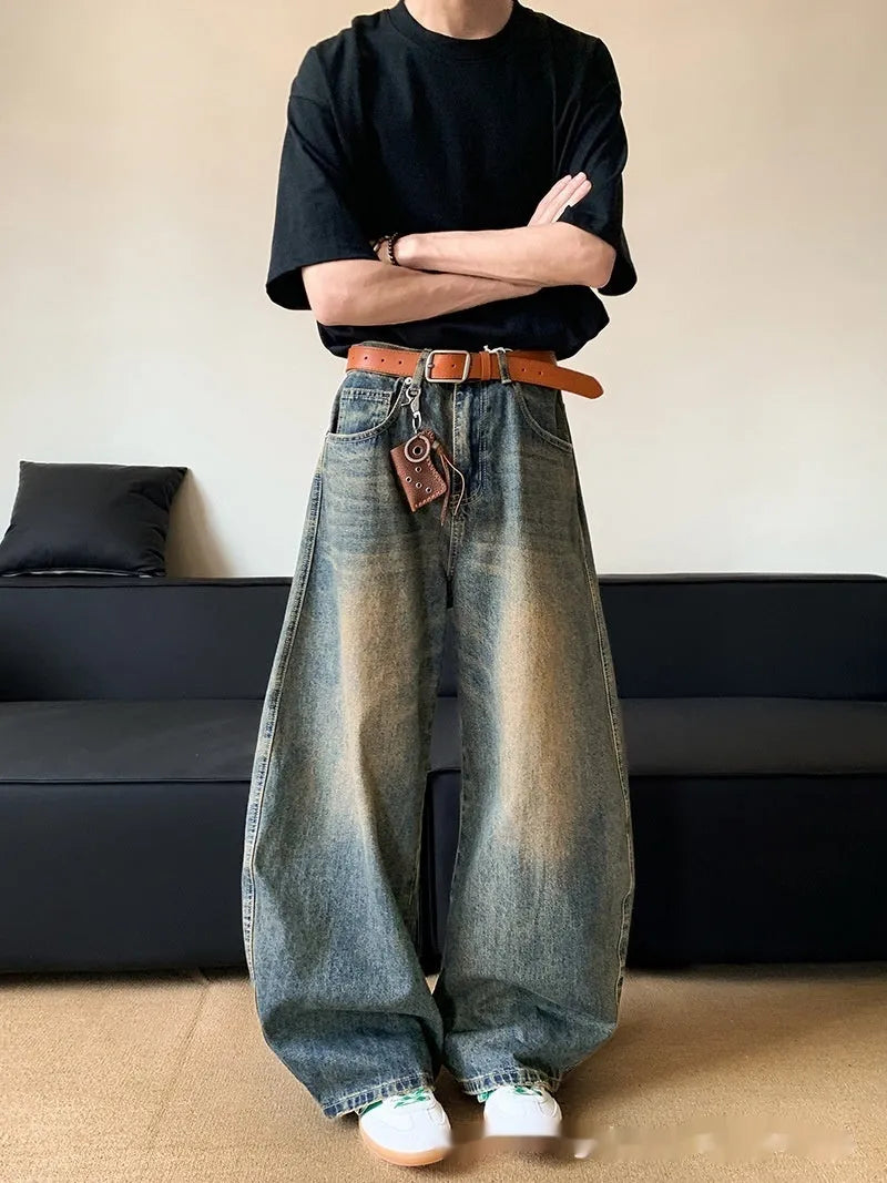 Men's distressed denim jeans in retro blue colour with wide-leg design and mid-waist fit